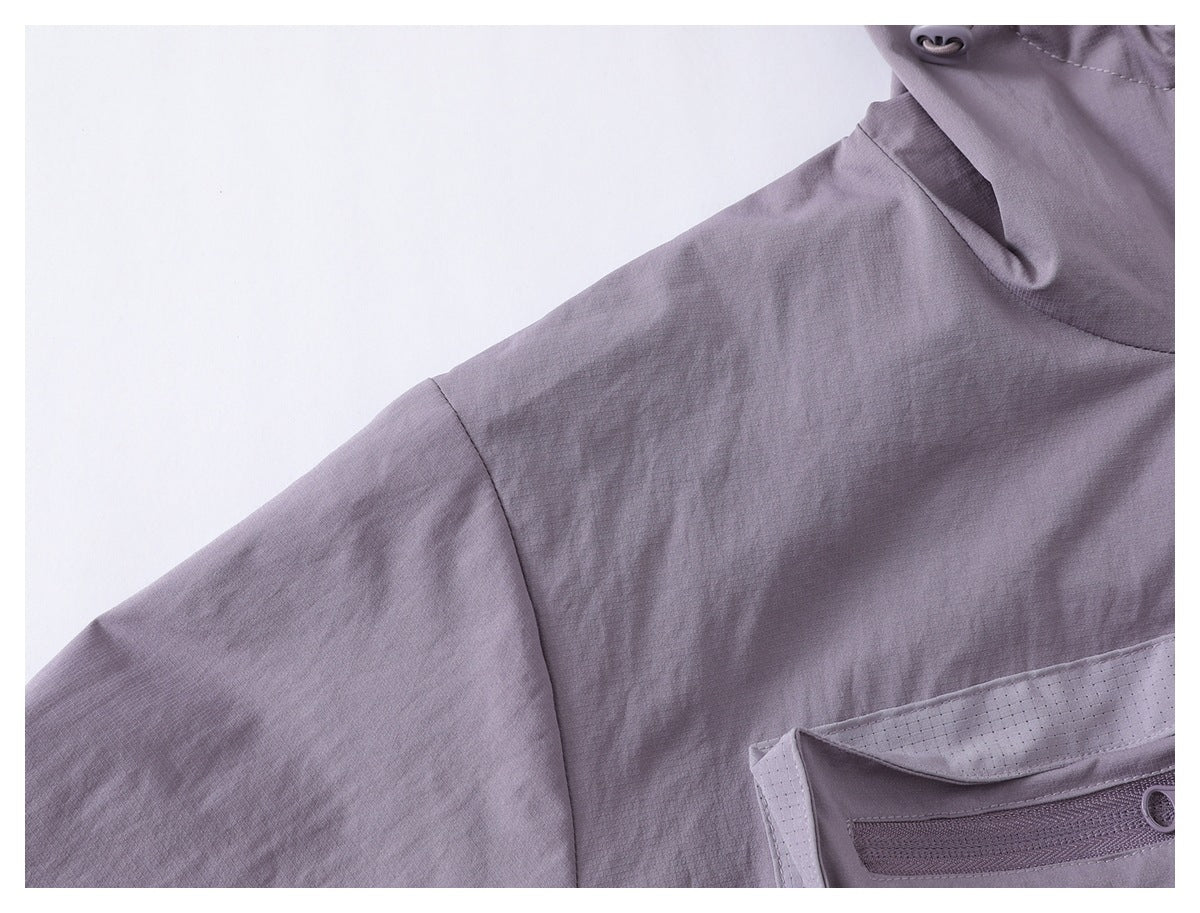 Close-up of the lavender jacket shoulder and sleeve, with part of a zippered pocket visible.