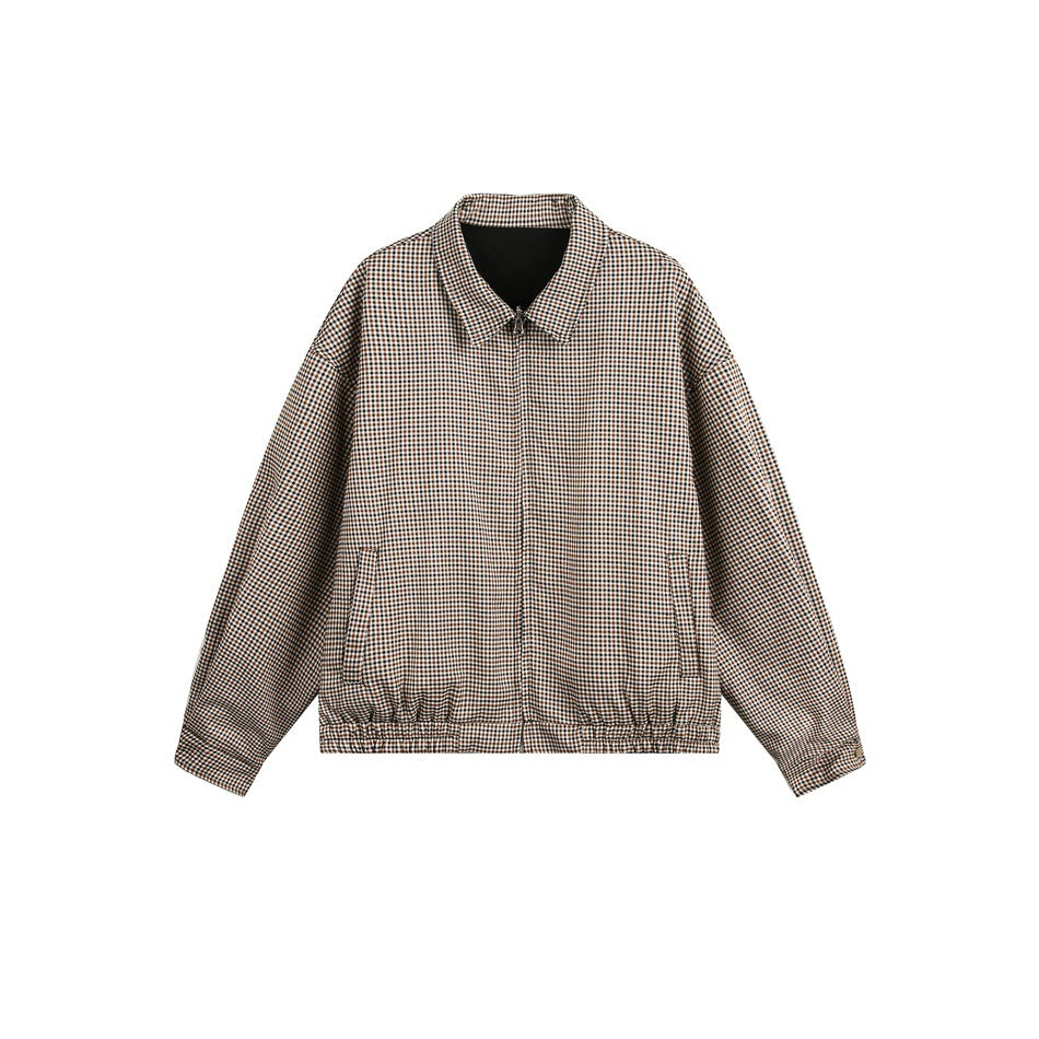 Front view of a brown, black, and cream micro-check zip jacket with a pointed collar, side pockets, and elastic hem.