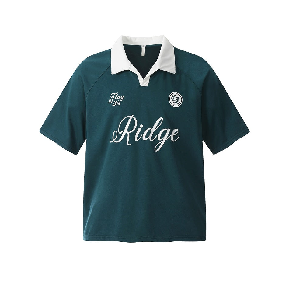 Dark green short-sleeve polo top with white open collar and white script Ridge print on the chest