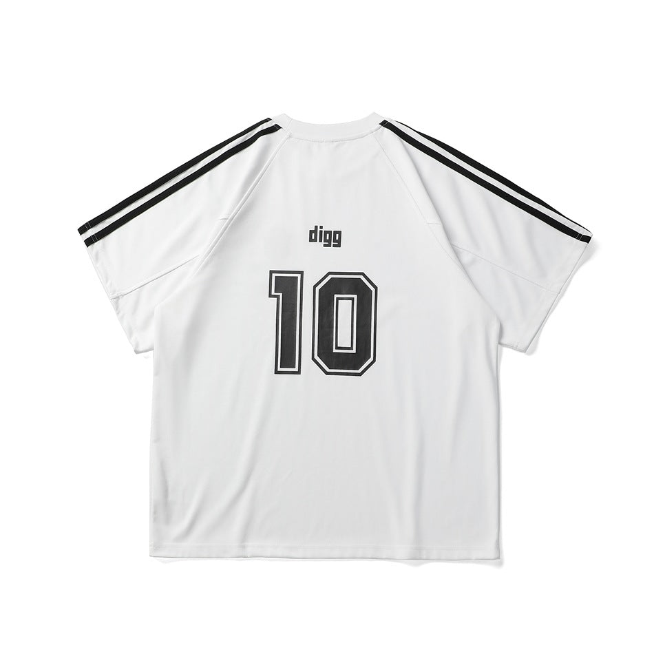 Back view of a white short-sleeve shirt with black shoulder stripes, “digg” lettering and a large outlined number 10.