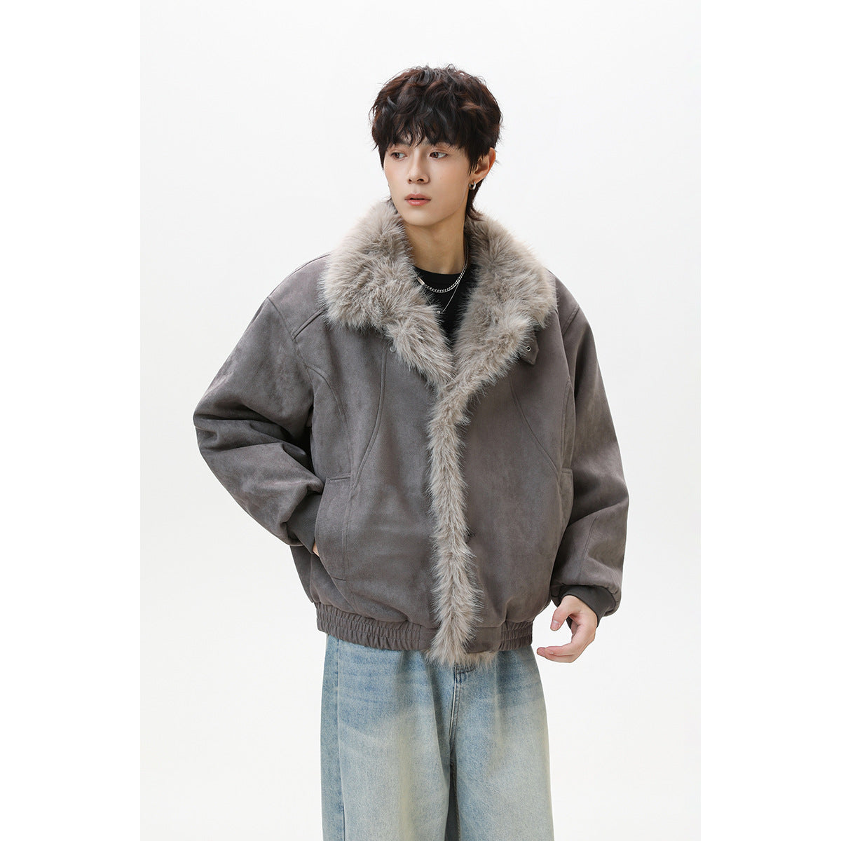 Model wearing a gray oversized jacket with a plush light gray fur collar and front trim.