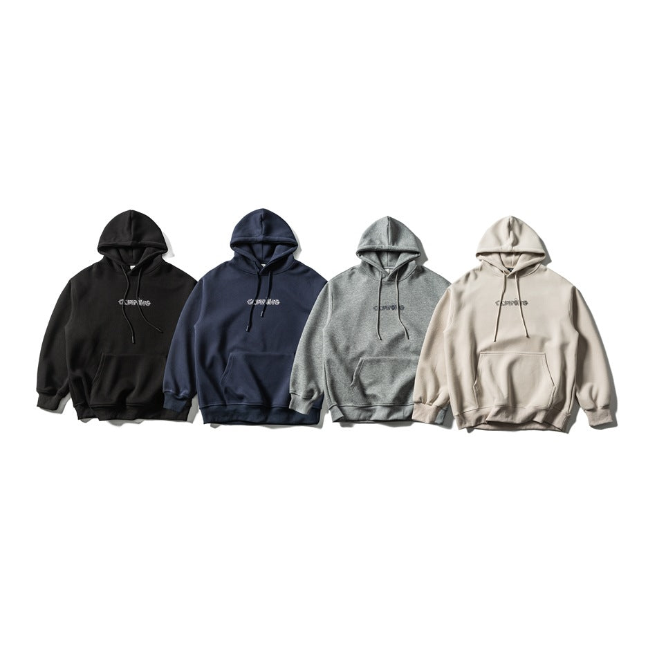 Four hoodies arranged side by side in black, navy, heather gray, and beige, each with a front pouch pocket.