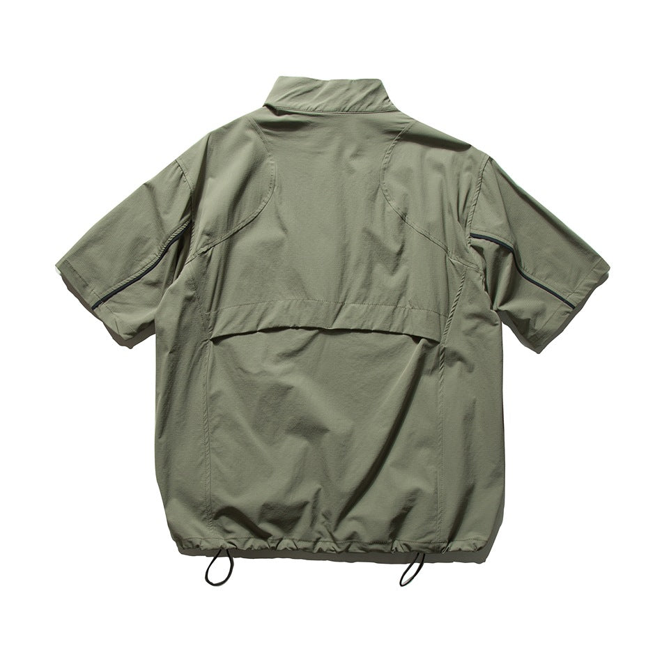 Back of olive green short-sleeve jacket showing back yoke seam, curved panel seams, and drawcord hem toggles, flat lay