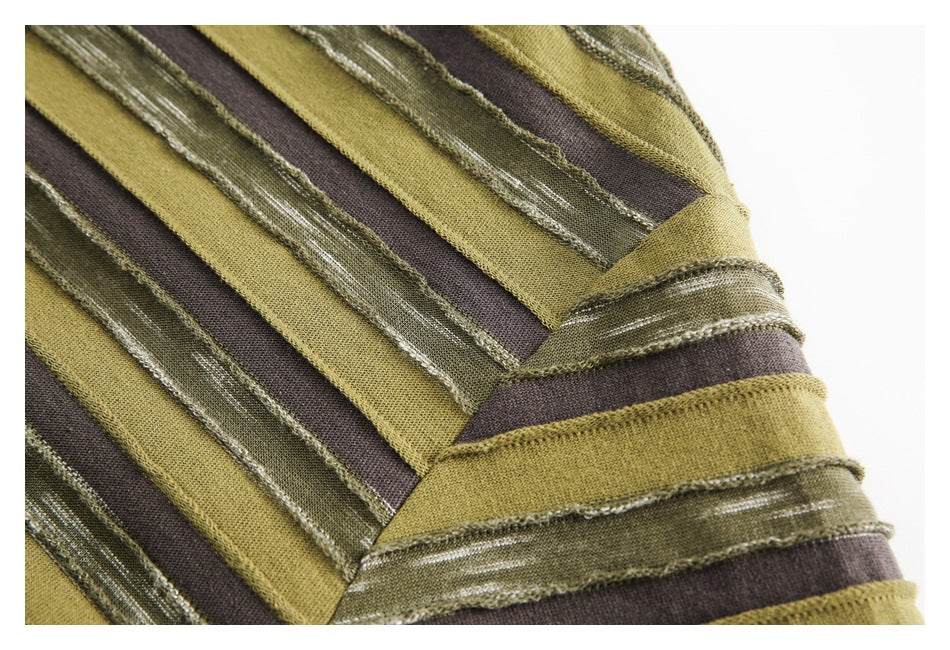 Close-up of striped shirt fabric and a stitched seam, showing olive, brown, and textured green bands.