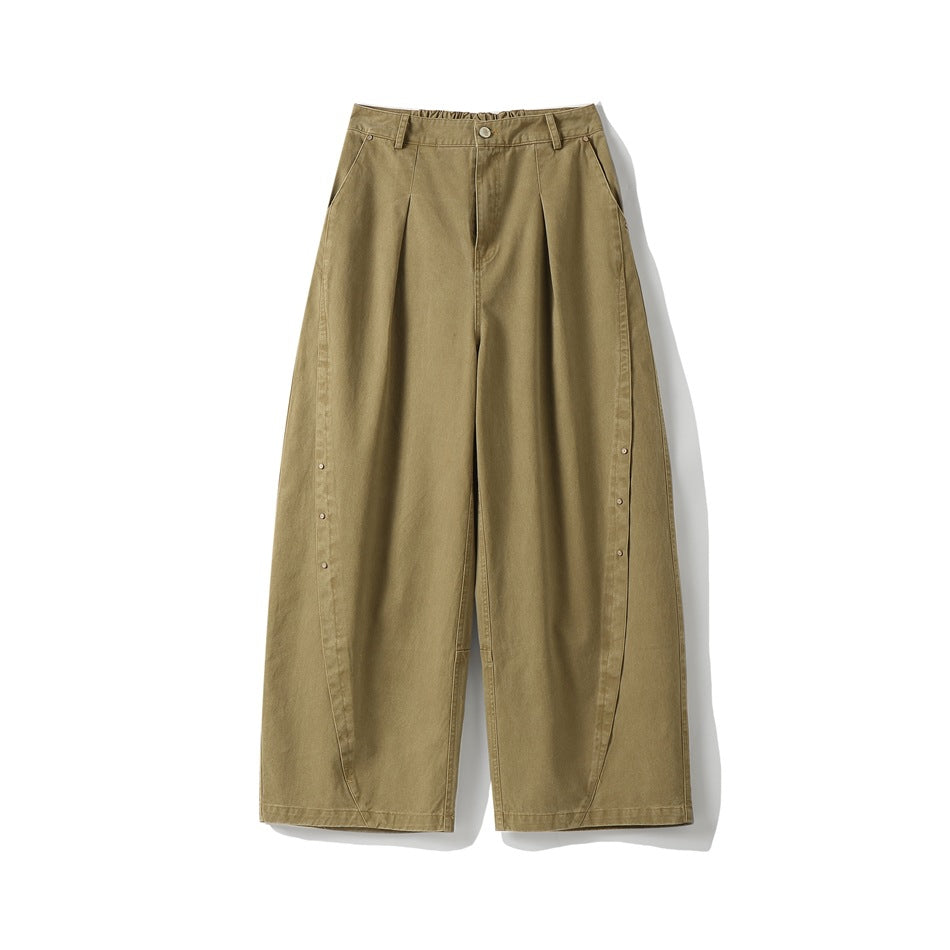 Khaki wide-leg pleated pants flat lay, front view with zip fly, button, side pockets and rivet-trimmed curved side seams