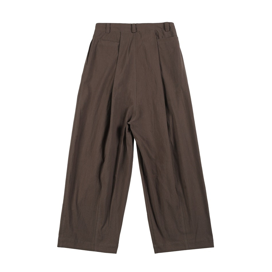Coffee brown wide-leg trousers, flat lay back view with two back pockets and a center pleat