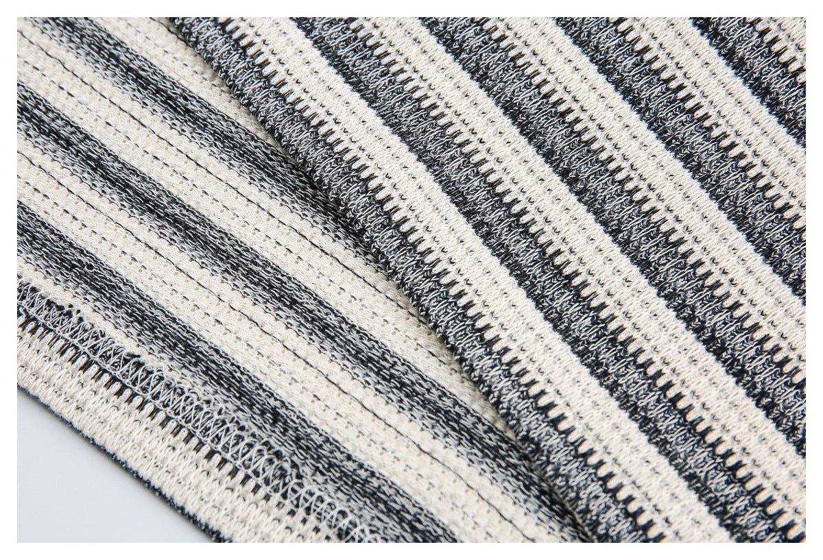 Close-up showing the inside seam stitching and striped knit fabric of the garment.
