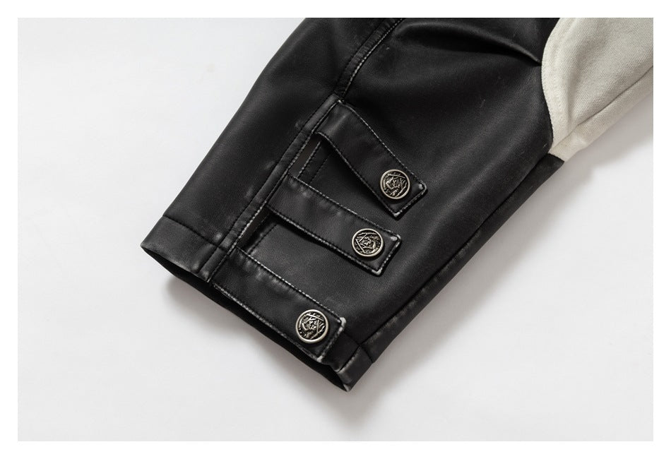 Close-up of a black jacket cuff with three decorative metal buttons and an off-white sleeve panel.