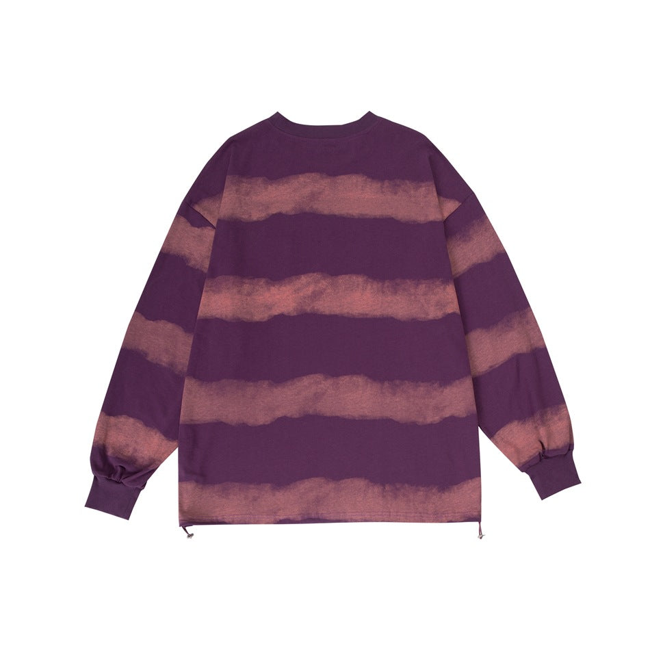 Back view of a purple long-sleeve sweatshirt with broad muted rose stripes and ribbed cuffs.