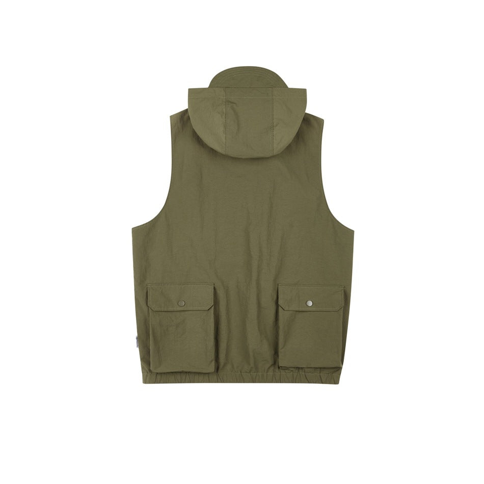 Back view of an olive sleeveless utility vest with a hood and two large flap pockets.