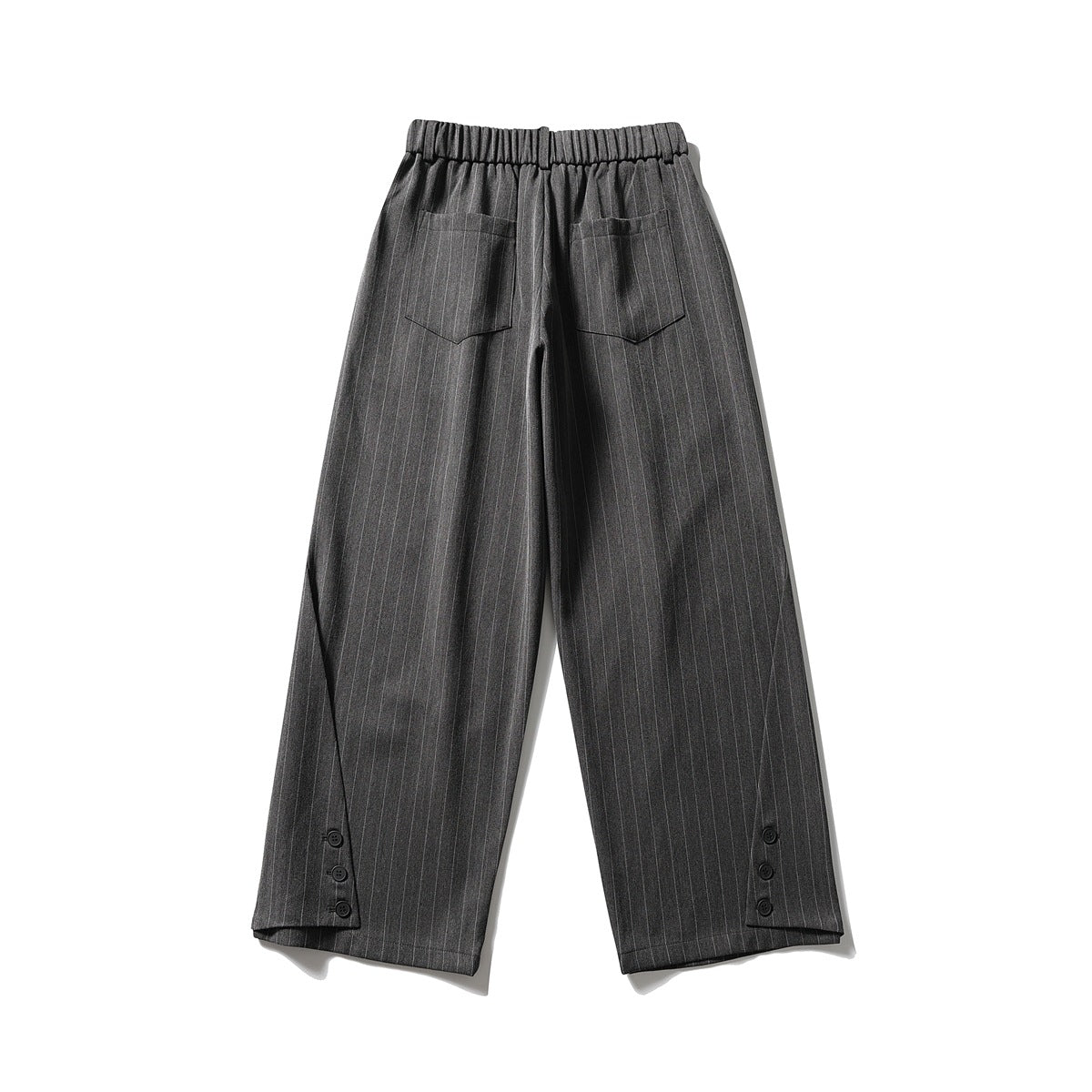 Back view of dark charcoal pinstripe wide-leg trousers with an elastic waistband, two patch pockets, and buttoned hems.