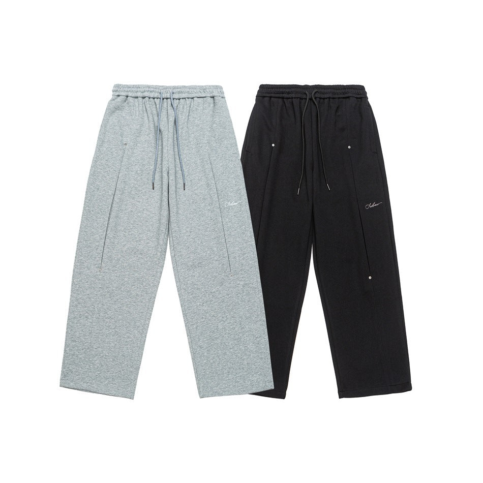 Light gray and black wide-leg drawstring pants shown side by side from the front.
