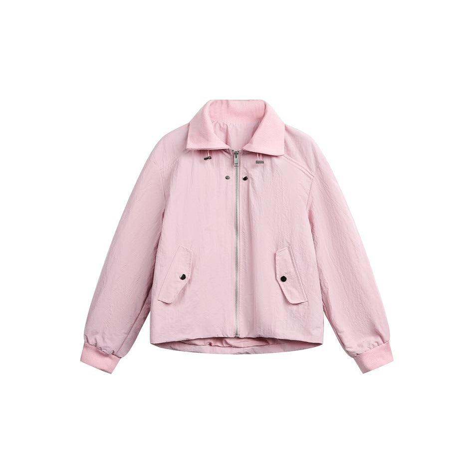 Pink cropped zip-front jacket with collar, snap flap pockets and ribbed cuffs on white background