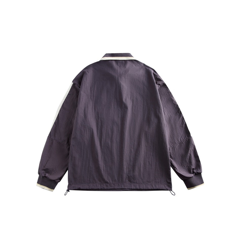 Back view of a dark purple pullover with cream collar and cuff trim, sleeve stripes, and an adjustable drawcord hem.