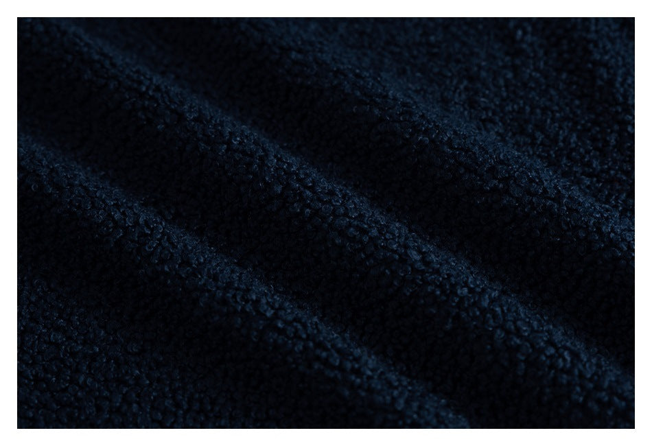 Extreme close-up of dark navy, looped fleece fabric texture.