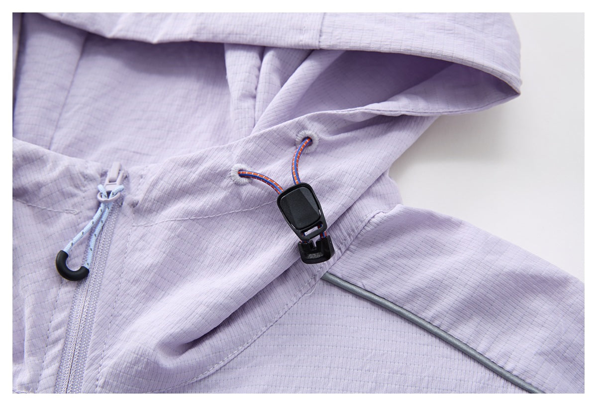 Close-up of the pale lavender jacket hood, drawcord toggle, zipper, and gray piping.