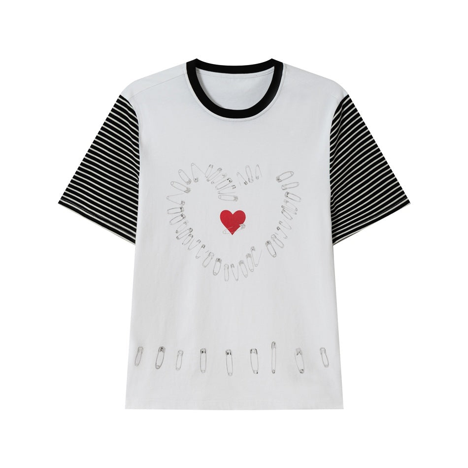 White short-sleeve tee with black collar, striped sleeves, safety-pin heart graphic and red heart on the front