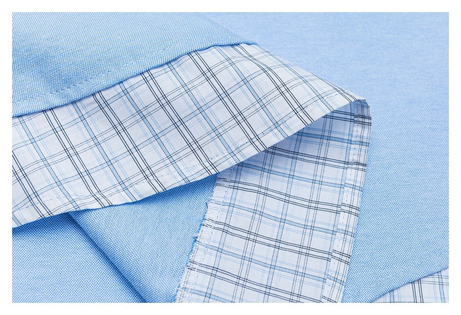 Close-up of the shirt’s light plaid inner fabric and pale blue outer fabric.
