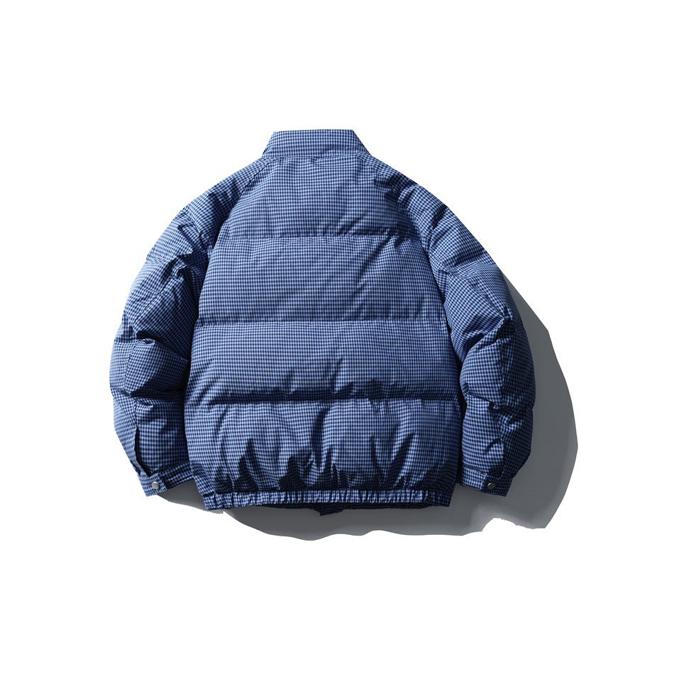 Back view of a navy blue checked padded jacket with a stand collar and horizontal quilted panels.