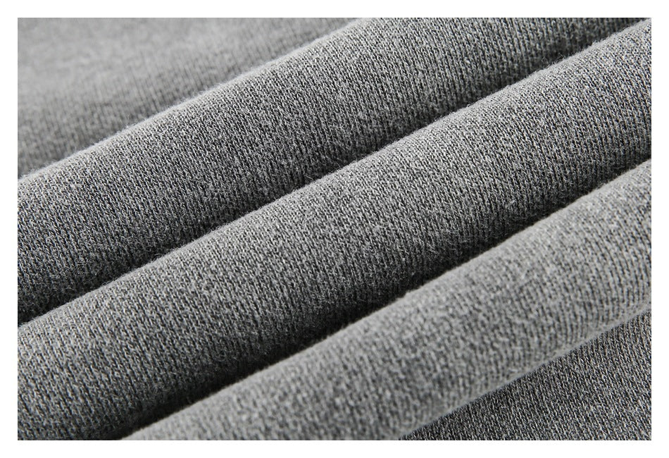 Macro close-up of the gray garment's knit fabric texture.