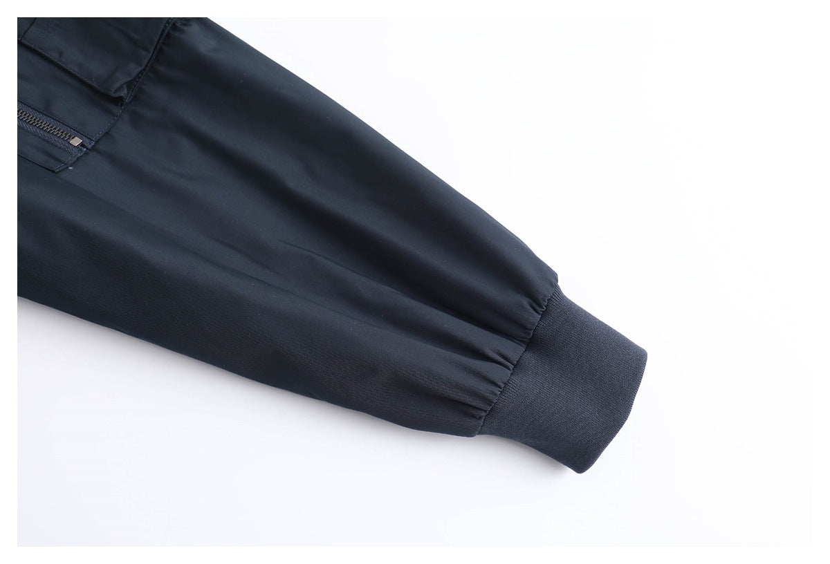 Close-up of a dark navy sleeve ending in a ribbed cuff.