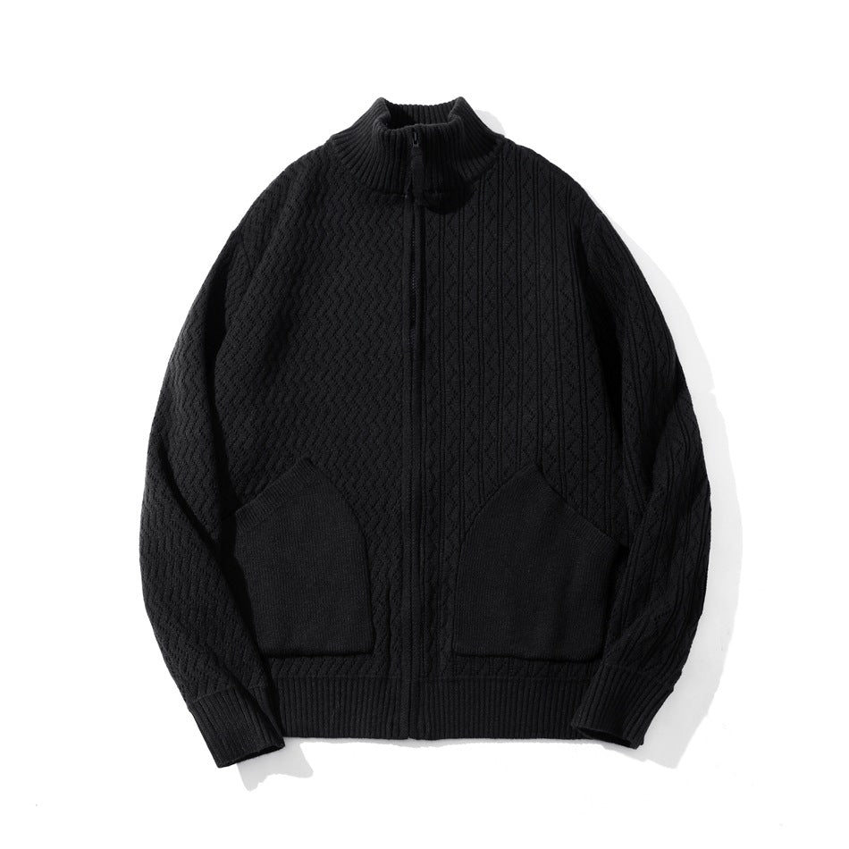 Black knit zip-up cardigan with stand collar, textured knit pattern and two patch pockets, flat lay
