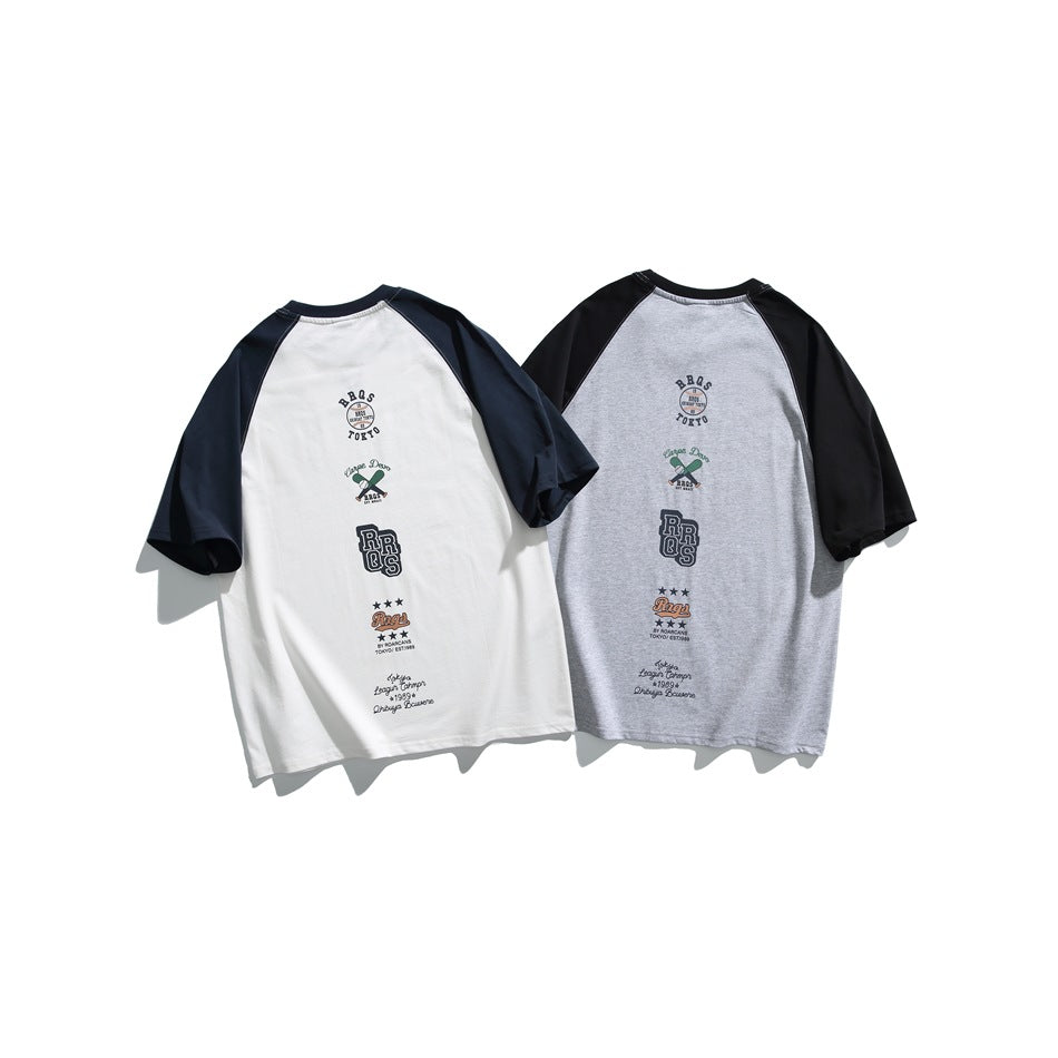 Two T-shirts shown from the back: one white with navy sleeves and one gray with black sleeves, both with vertical graphics.