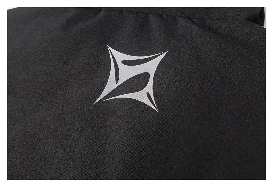 Close-up of a white abstract emblem printed on black garment fabric.