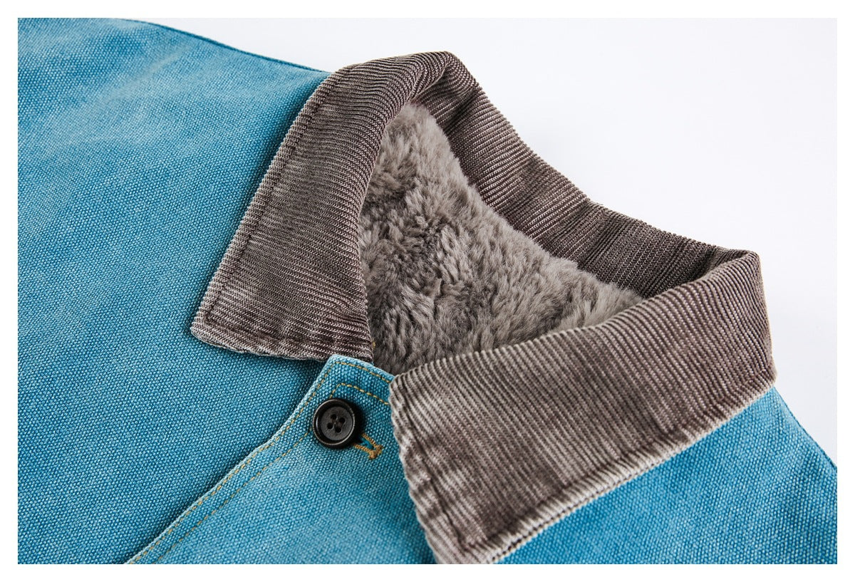Close-up of a teal jacket's dark brown collar, gray plush lining, and black top button.