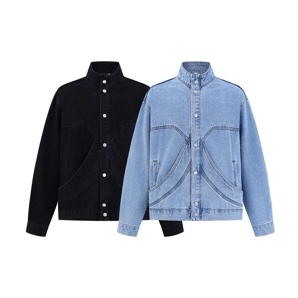 Two front views of a stand-collar denim jacket, one black and one light blue, with snap fronts and curved pockets.