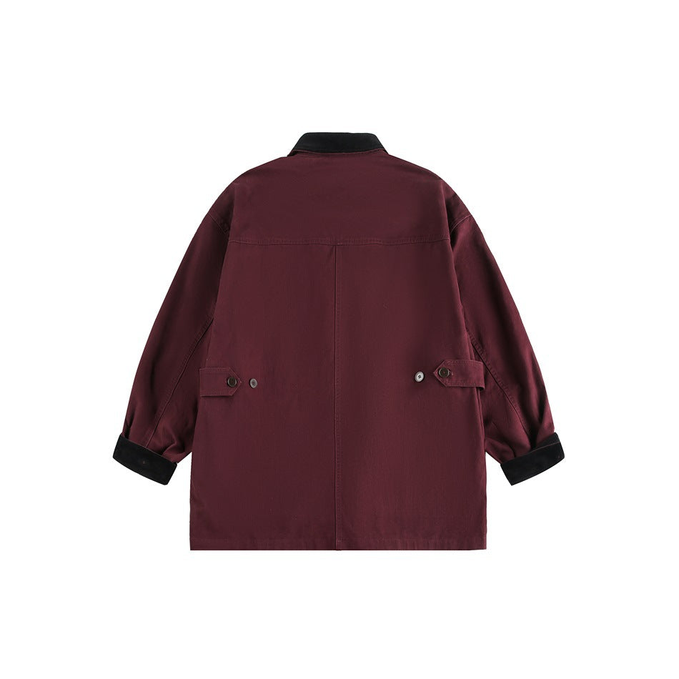 Back view of a burgundy jacket with a black collar and cuffs, center seam, and adjustable side tabs.