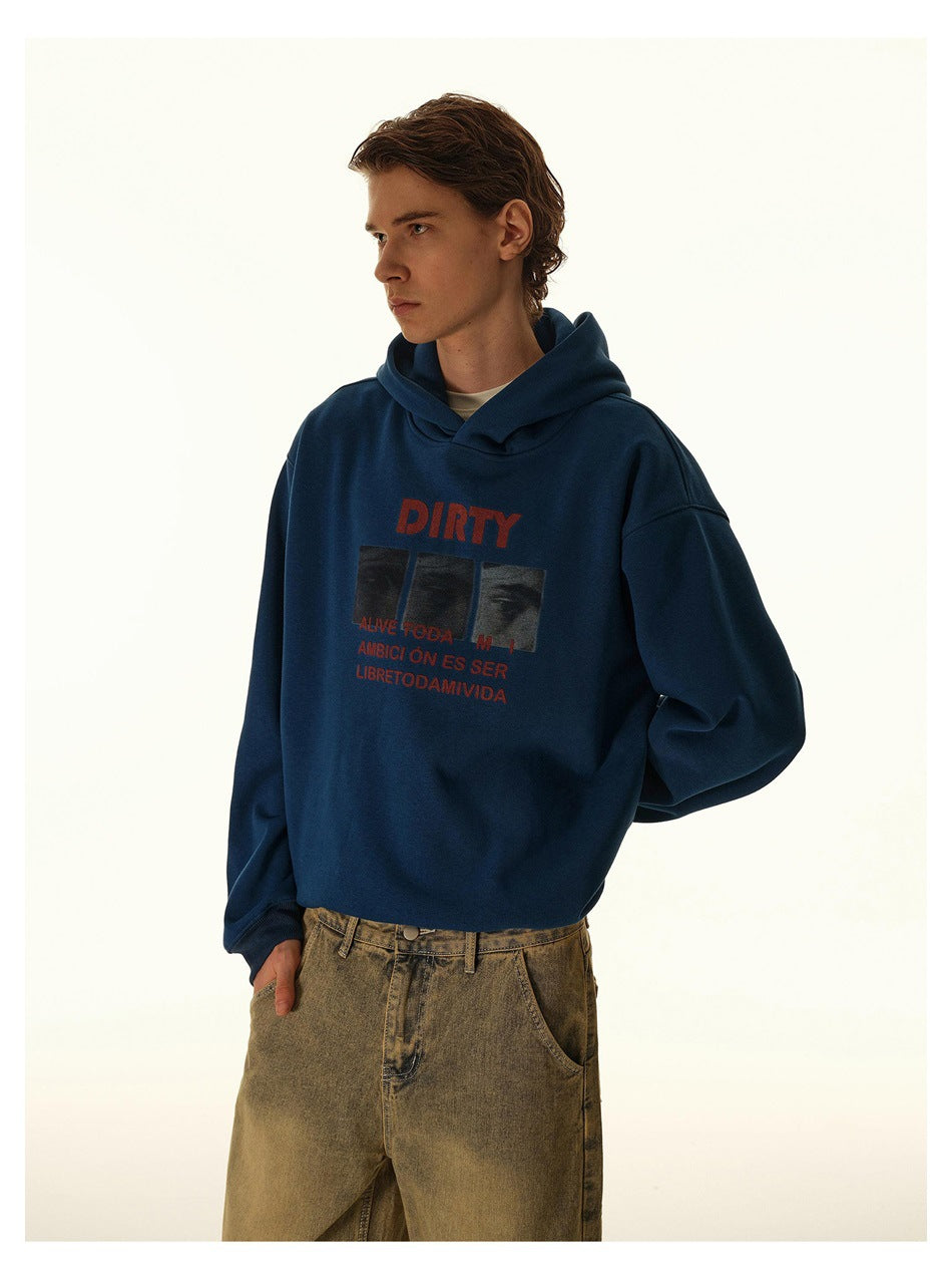 Model wearing a navy hoodie with red graphic text, shown from the front in a three-quarter view.