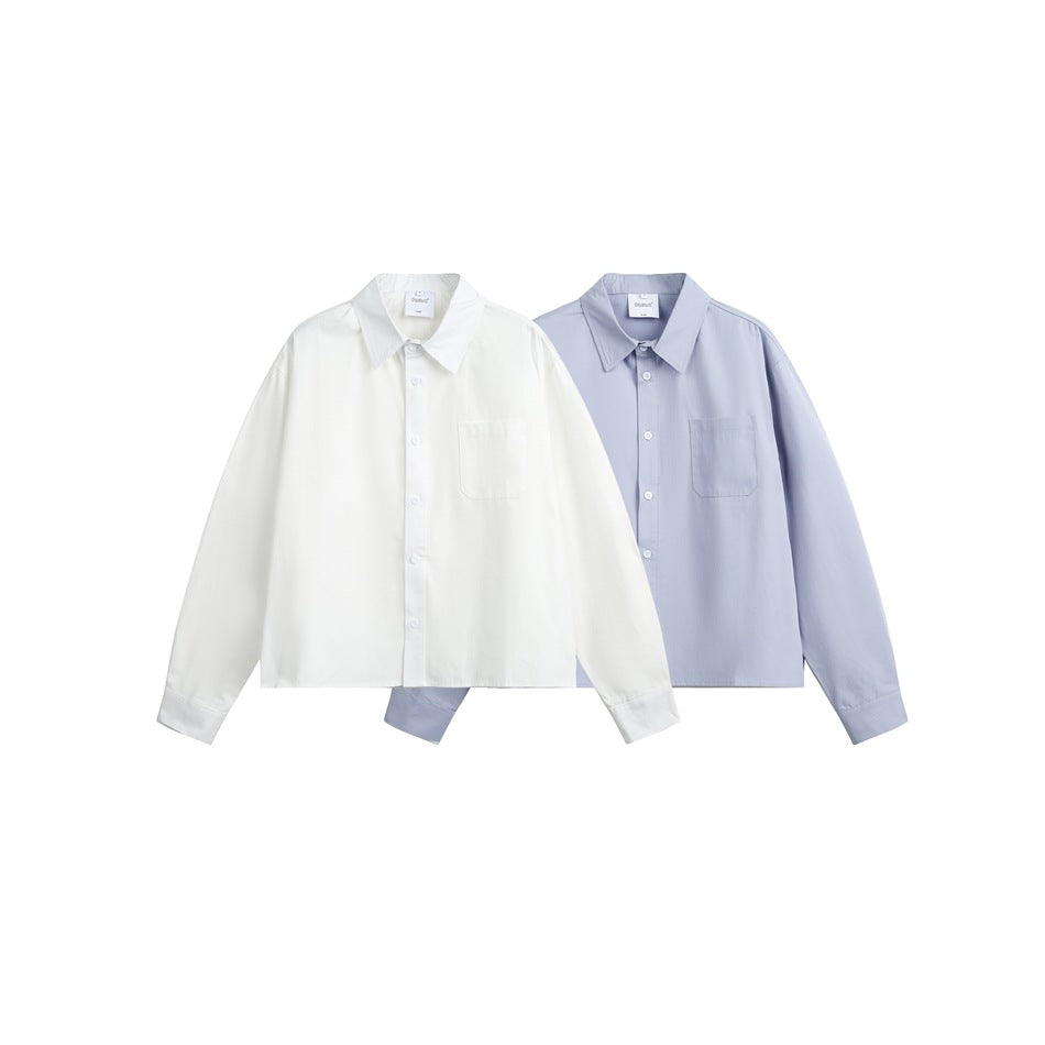 Two long-sleeve button-up shirts with chest pockets shown together in white and pale blue.