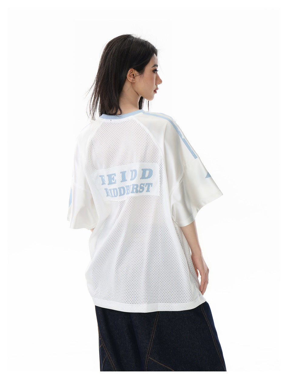 Model showing the back of a white mesh jersey with pale blue trim and lettering.