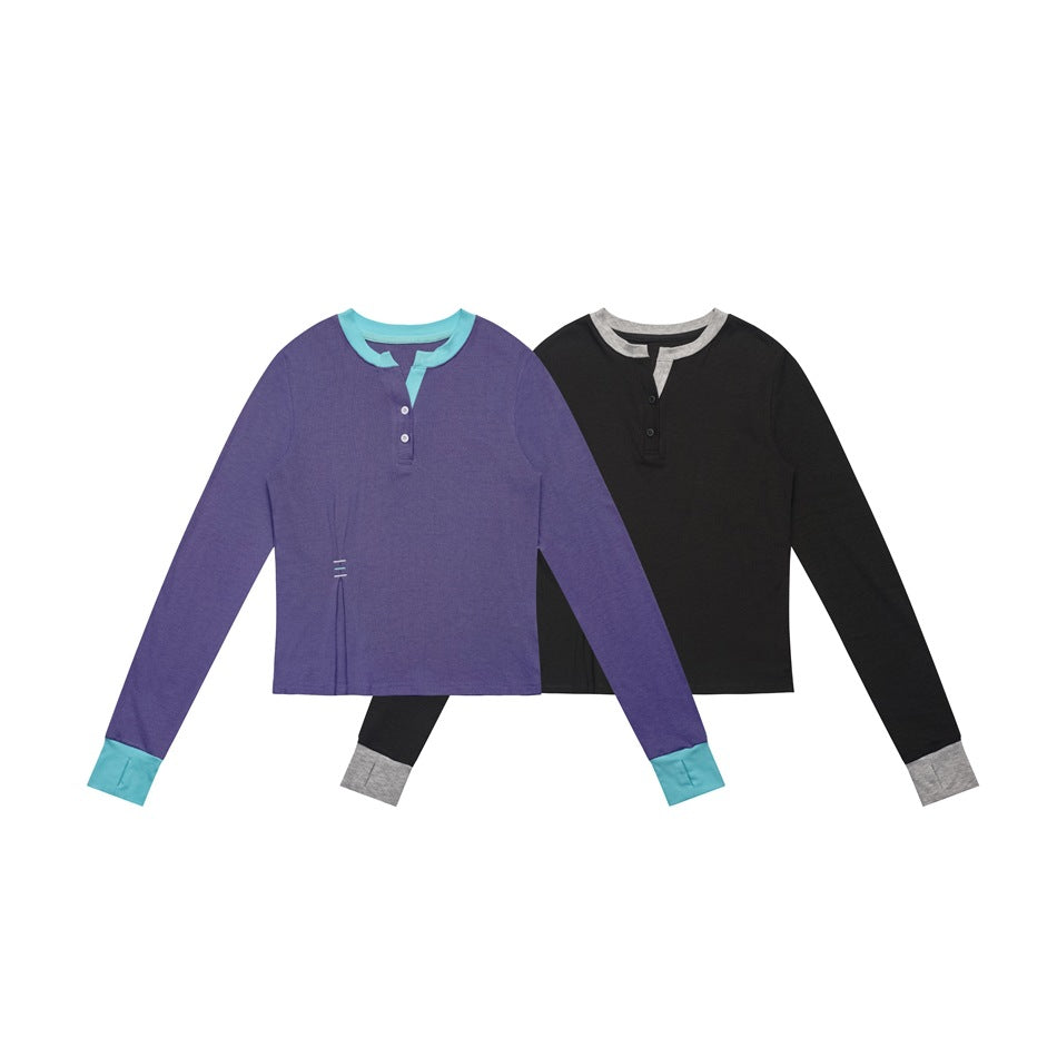 Front views of two long-sleeve tops: purple with turquoise trim and black with gray trim.