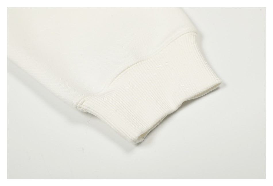 Close-up of a white sleeve ending in a wide ribbed cuff.