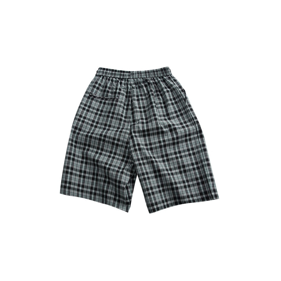Back view of dark green-gray plaid shorts with an elastic waistband and a small rear pocket.
