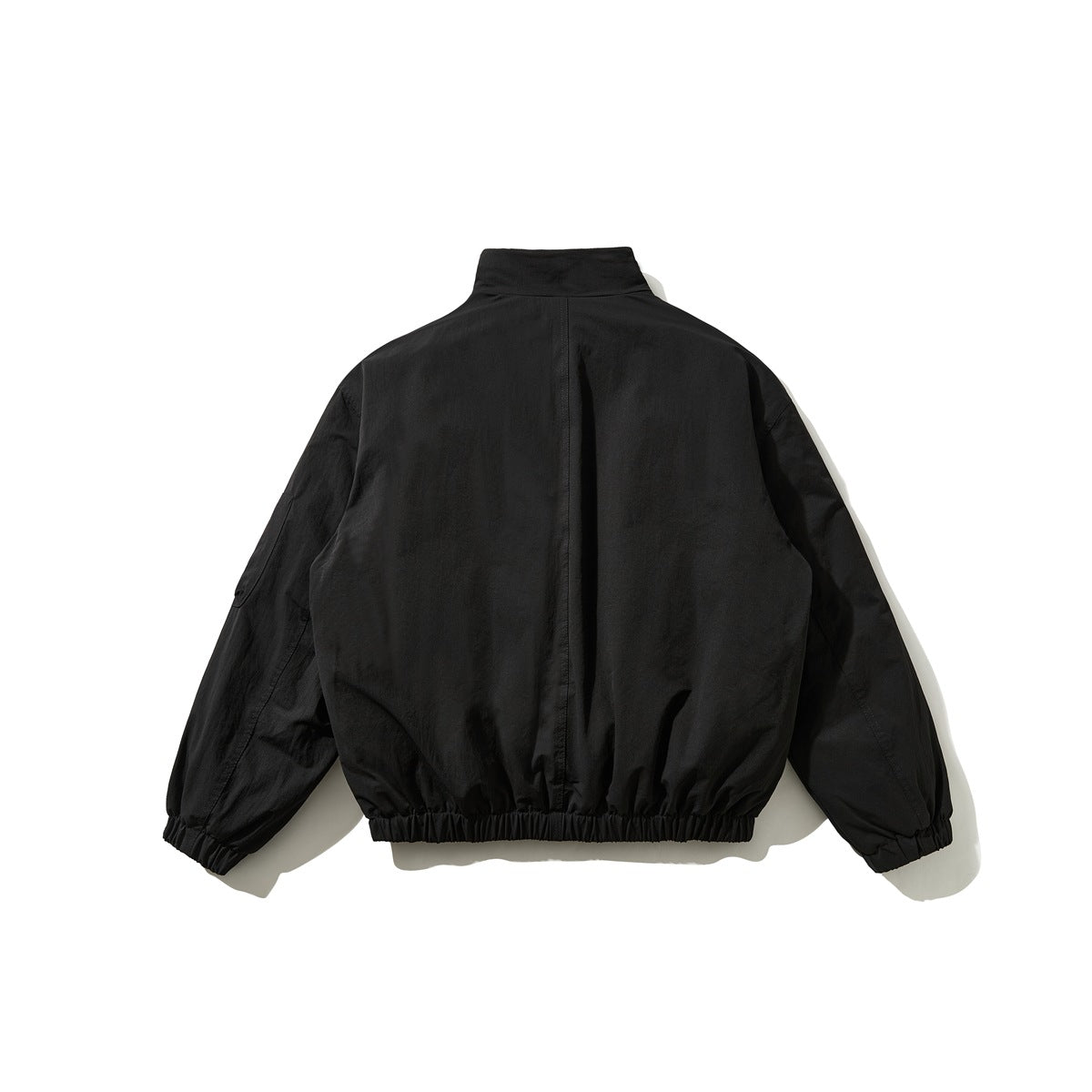 Back view of black stand-collar jacket with center back seam, elastic hem and elastic cuffs