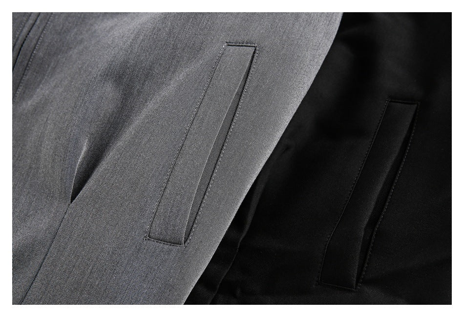 Close-up comparing narrow welt pockets on gray and black jacket fabric.