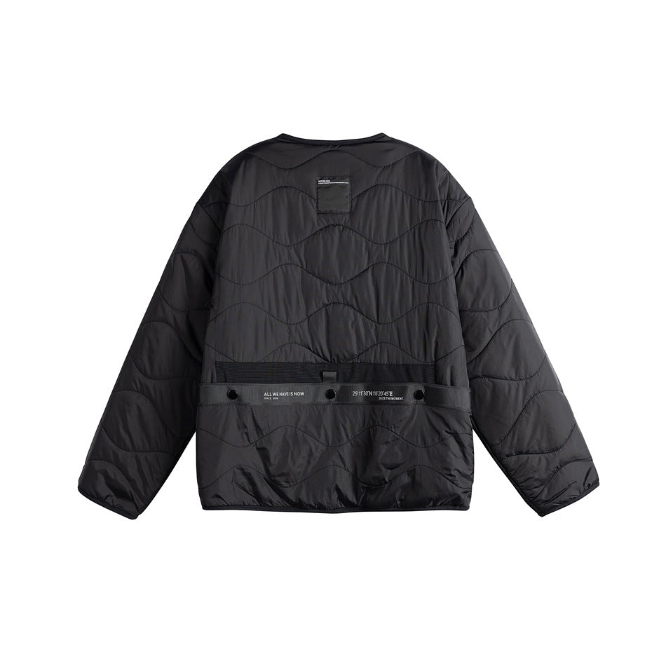 Black quilted jacket, back view, wavy quilting and black waist strap with snaps