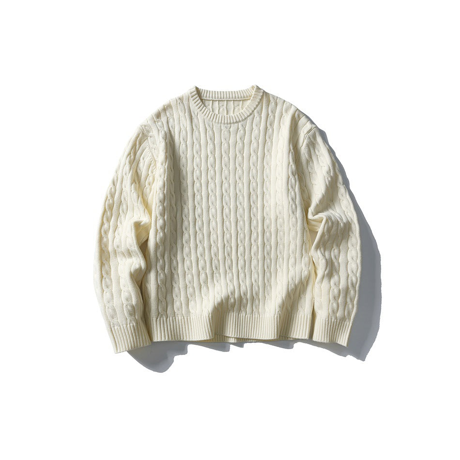 Beige-apricot cable-knit crew-neck sweater laid flat, front view