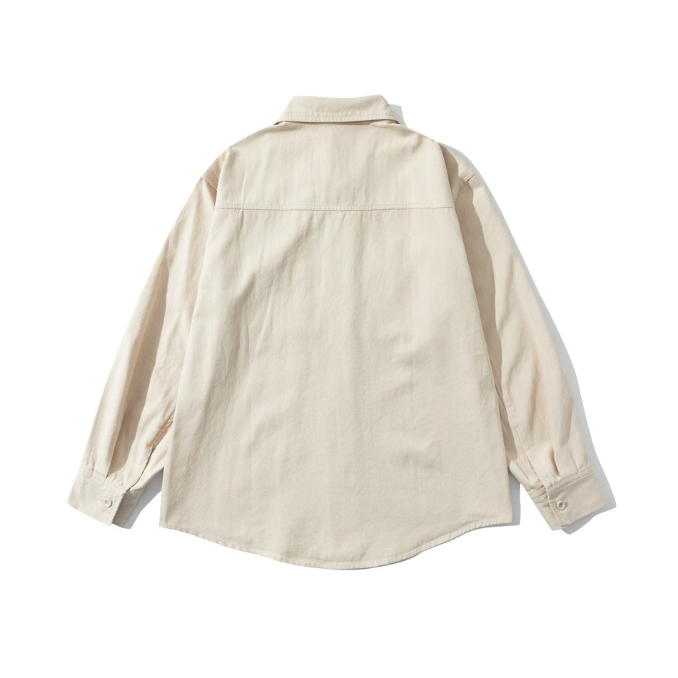 Back view of a cream long-sleeve shirt with a pointed collar, shoulder yoke, and curved hem.