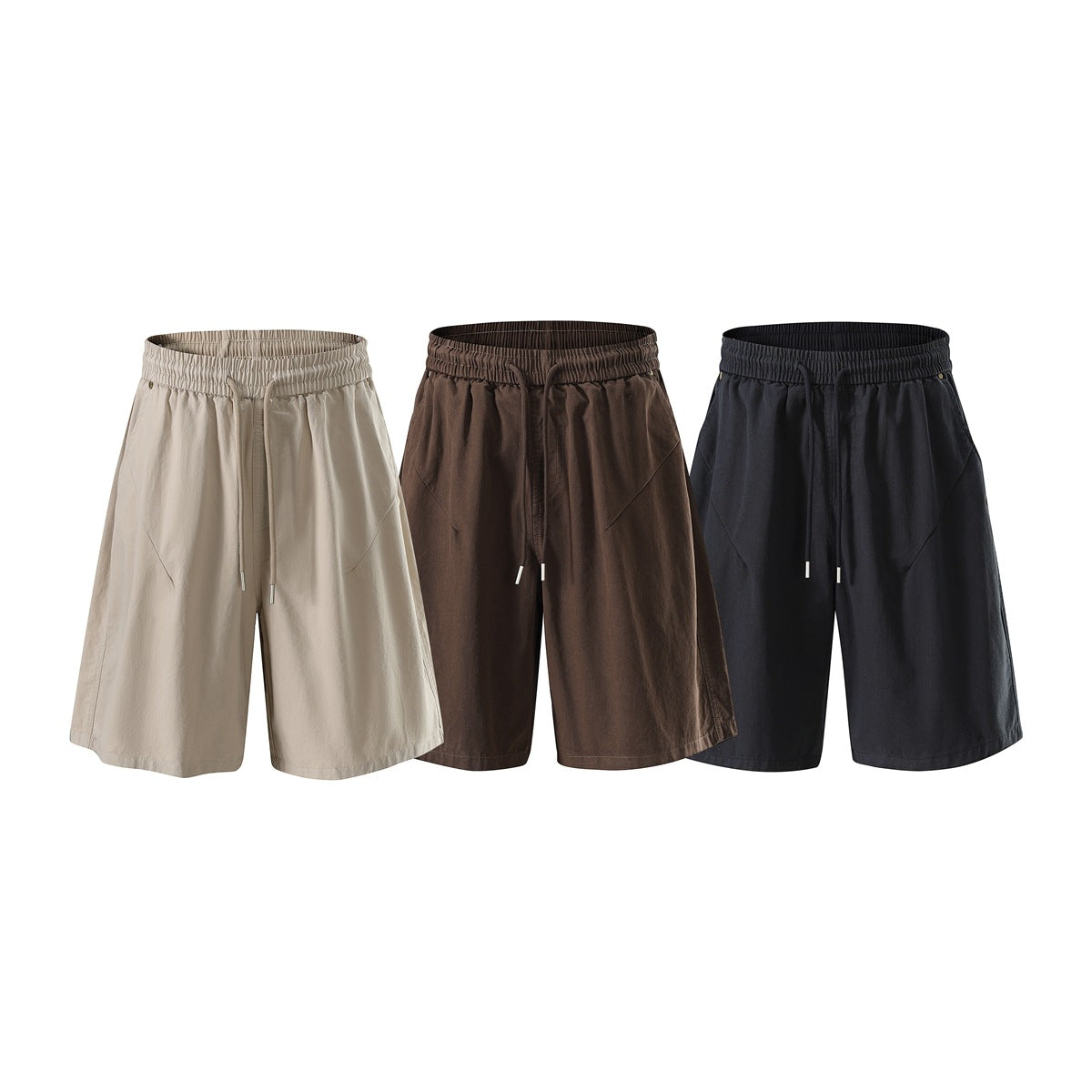 Three pairs of wide-leg shorts shown from the front in beige, brown and dark navy, each with an elastic drawstring waist.