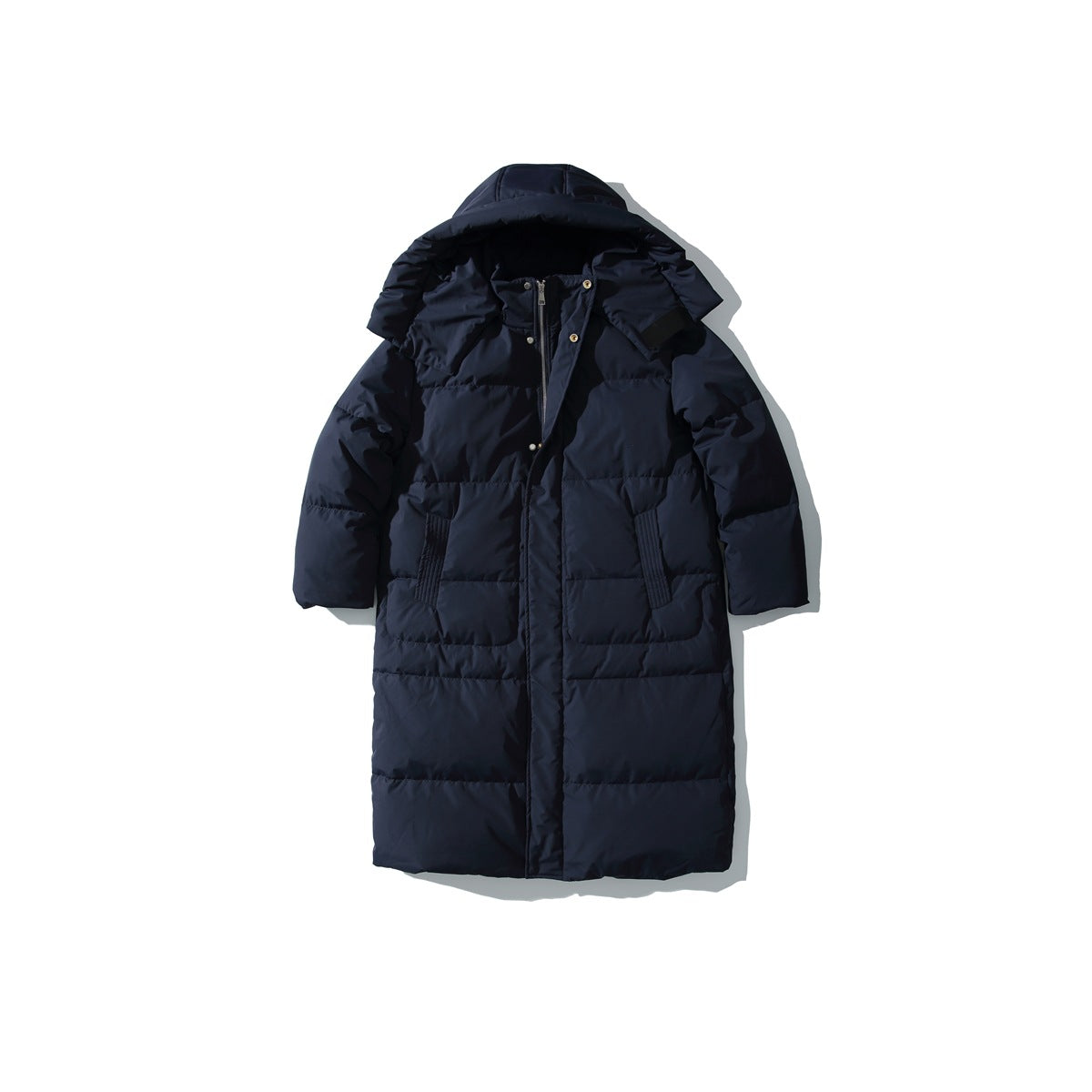 Navy long quilted puffer jacket with hood attached, snap collar details and front pockets, flat lay