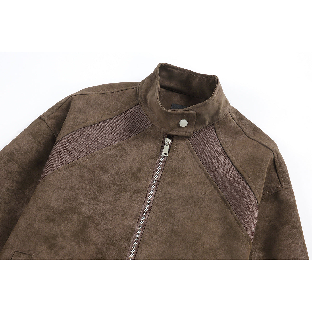 Close-up of a brown jacket's stand collar, silver zipper, and diagonal ribbed chest panels.