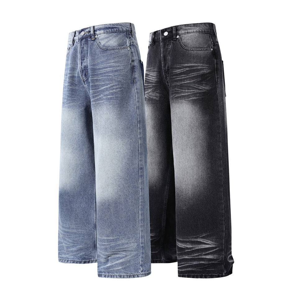 Two pairs of wide-leg jeans shown from the front: one faded blue and one charcoal black.