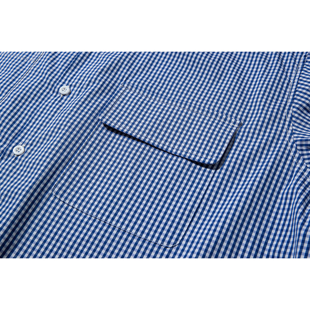 Close-up of a blue-and-white gingham shirt's button placket and chest pocket.
