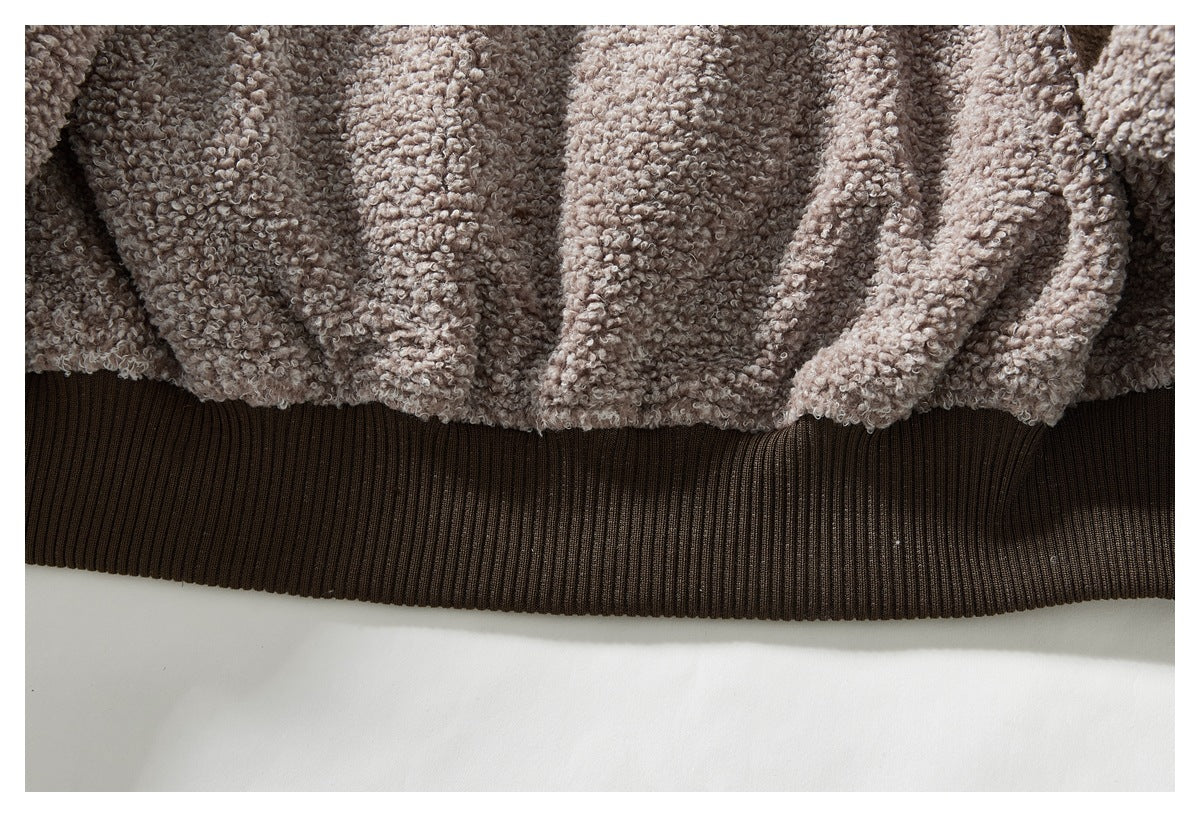 Close-up of the jacket's textured lining gathered above a dark brown ribbed hem.