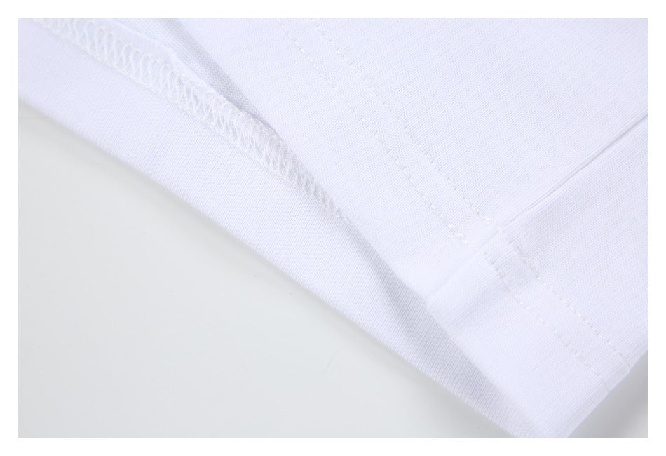 Close-up of a white garment hem with overlock stitching and a stitched edge.