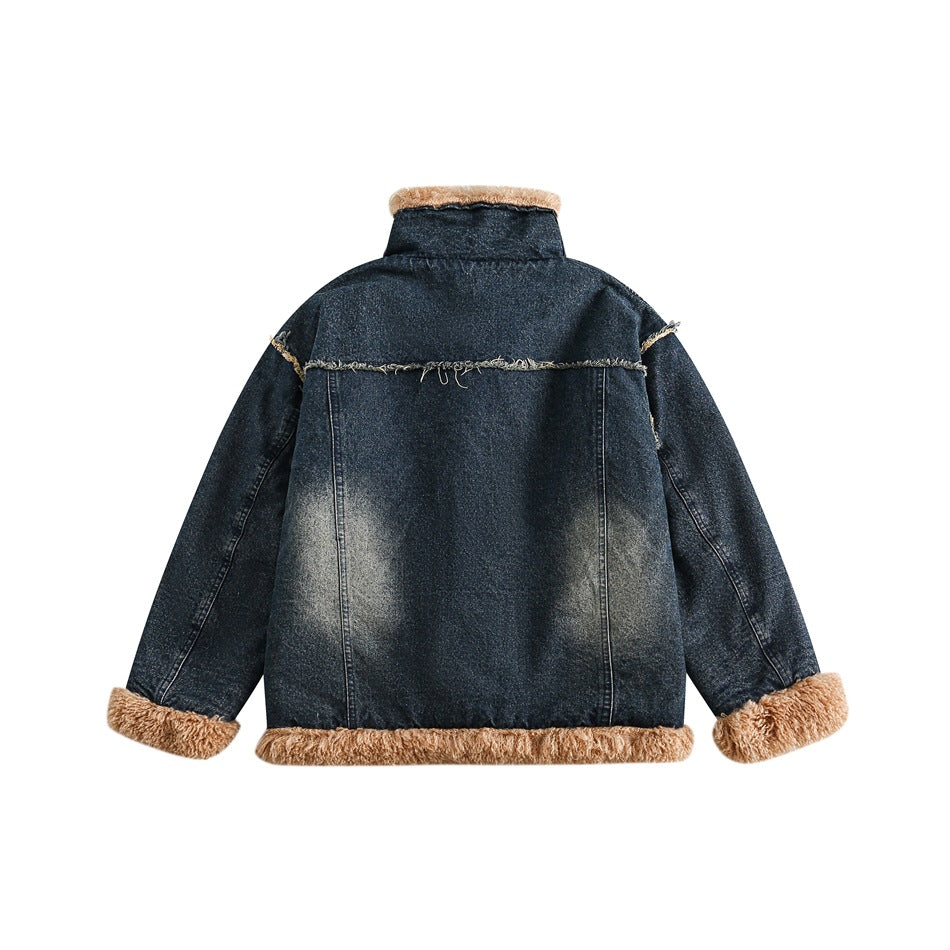 Back of a dark blue denim jacket laid flat, with tan shaggy trim at the collar, cuffs, and hem.